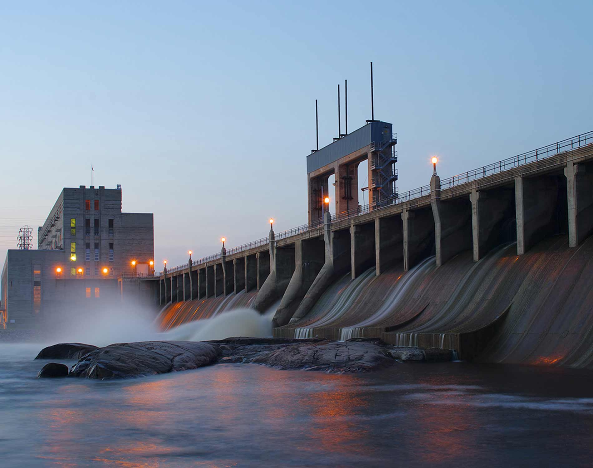 Landscape of a hydroelectric dam at dusk