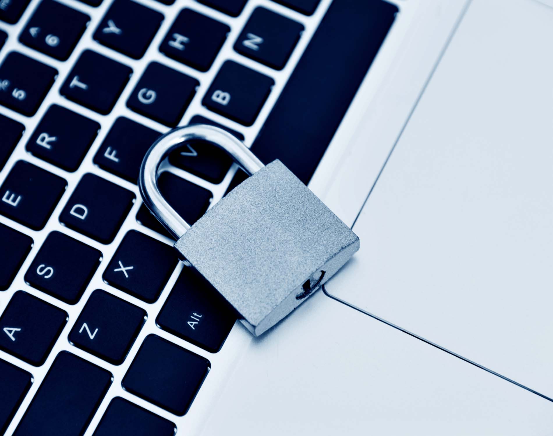 Padlock on laptop keyboard Padlock on laptop keyboard